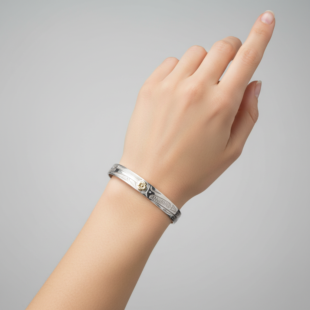 A 7mm width silver cuff bracelet with engraved geometric and floral patterns, featuring a central gold flower accent, shown on a plain white background.